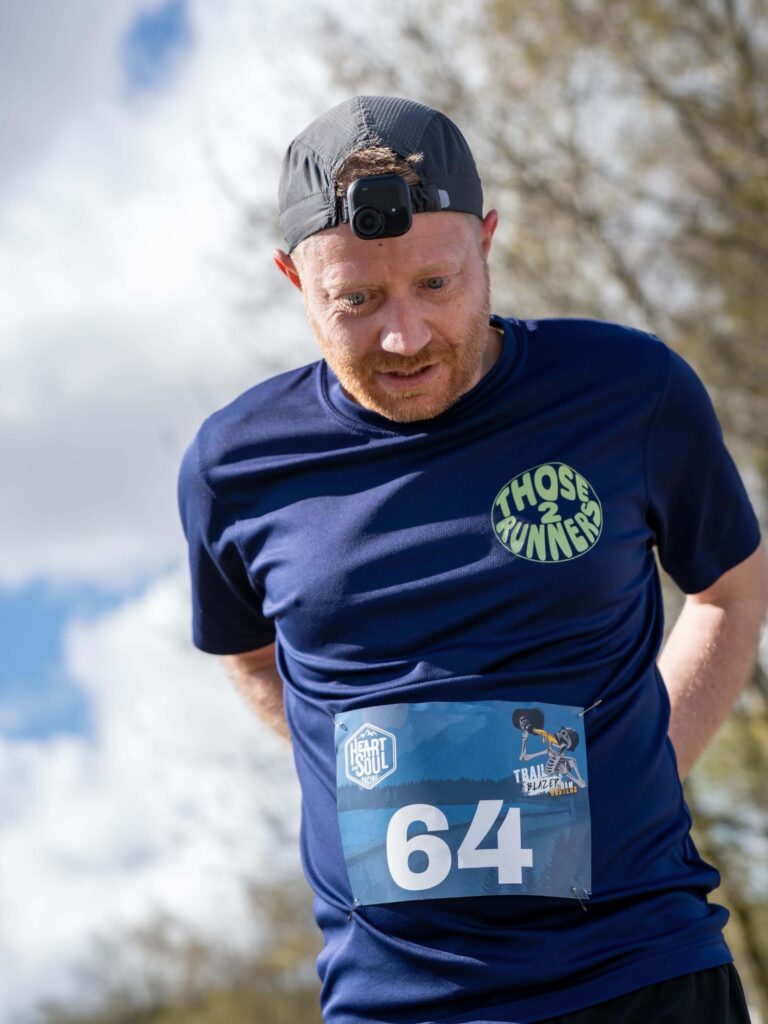 Chris wearing a race number on his Keep On Running T-shirt